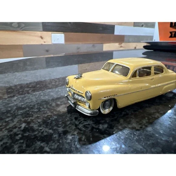 1:43 EMPIRE ZAUGG MODEL TIN WIZARD 6 MERCURY 51 1951 YELLOW